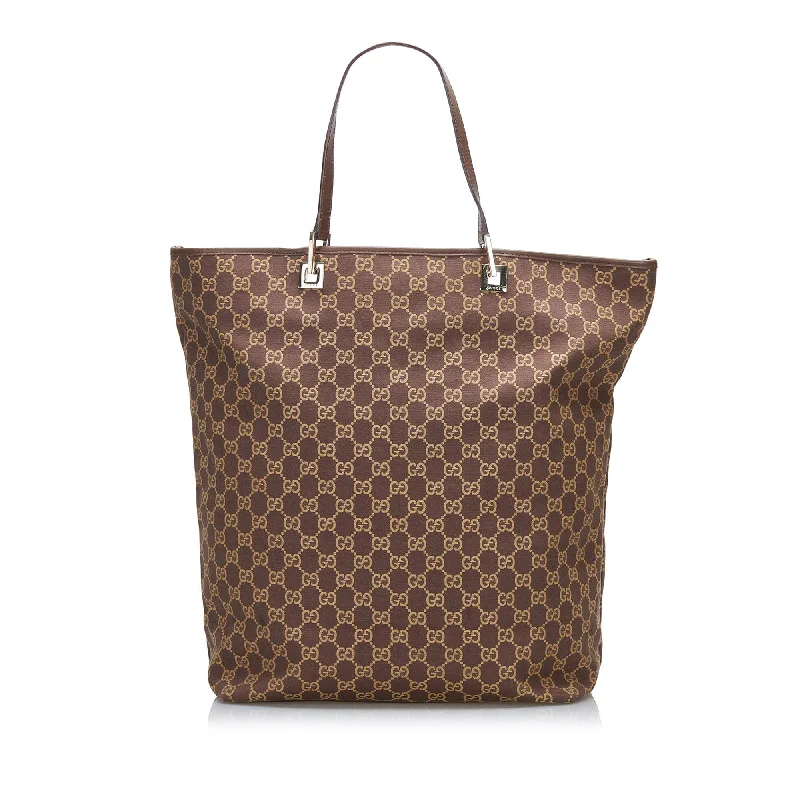 Women Gucci Sylvie bags with a monogram - embossed leatherGucci GG Canvas Tote Tote Bag