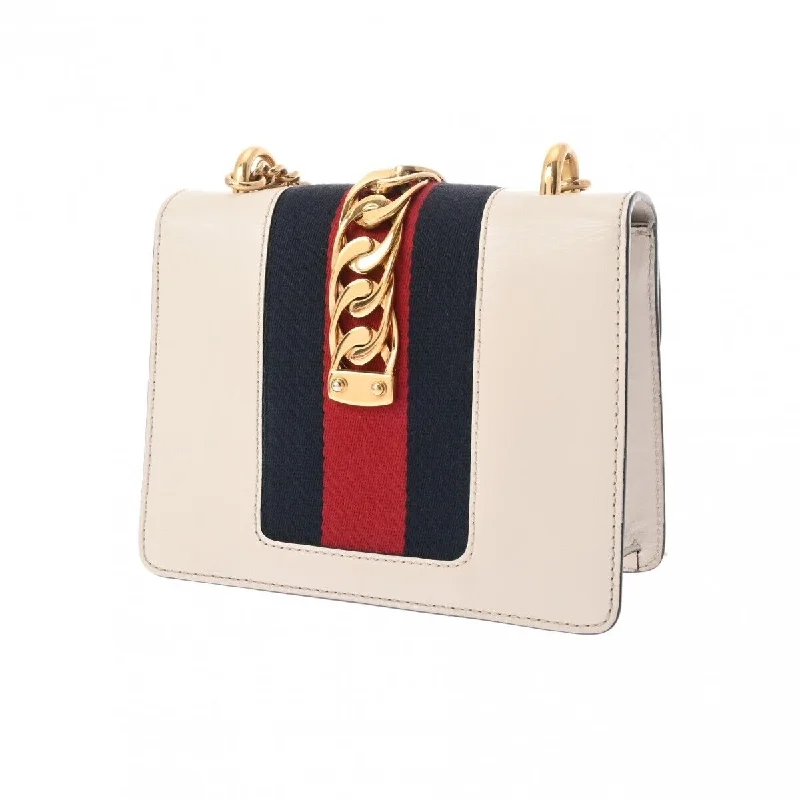 Women Gucci bags with a snap - button closure and a decorative charmGucci Silvi Mini Chain Shoulder Bag