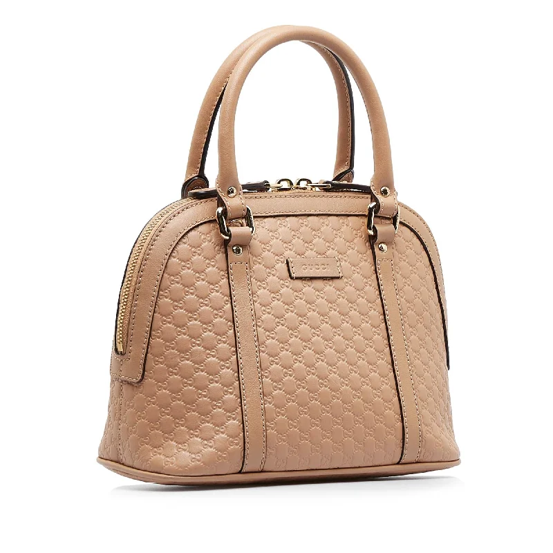 Women Gucci crossbody bags with a woven leather strapGucci Mini Microguccissima Dome Bag (SHG-zvA1OJ)