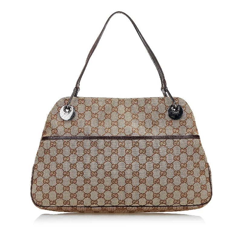 Women Gucci Sylvie bags with a crystal - embellished web stripeGucci GG Canvas Eclipse Tote Bag