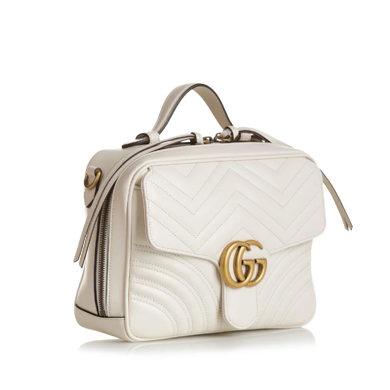 Women Gucci bags with interlocking G hardware for a classic lookGucci Small GG Marmont Matelasse Top Handle (SHG-puiWgw)