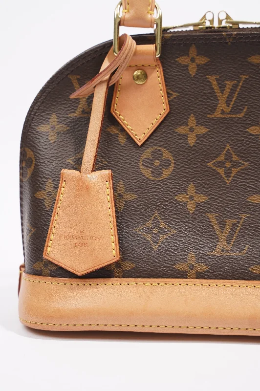 Louis Vuitton Twist bags with a snakeskin - effect panel for a bold lookLouis Vuitton Alma Monogram / Beige Canvas BB