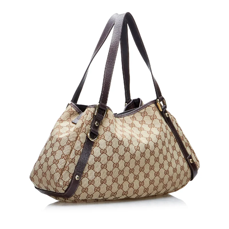 Ladies Gucci shoulder bags with a tassel decorationGucci GG Canvas Abbey D-Ring Shoulder Bag (1FtxtO)