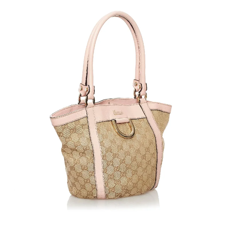 Women Gucci Sylvie bags with a monogram - embossed leatherGucci GG Canvas Abbey Tote Bag (SHG-noPqrr)