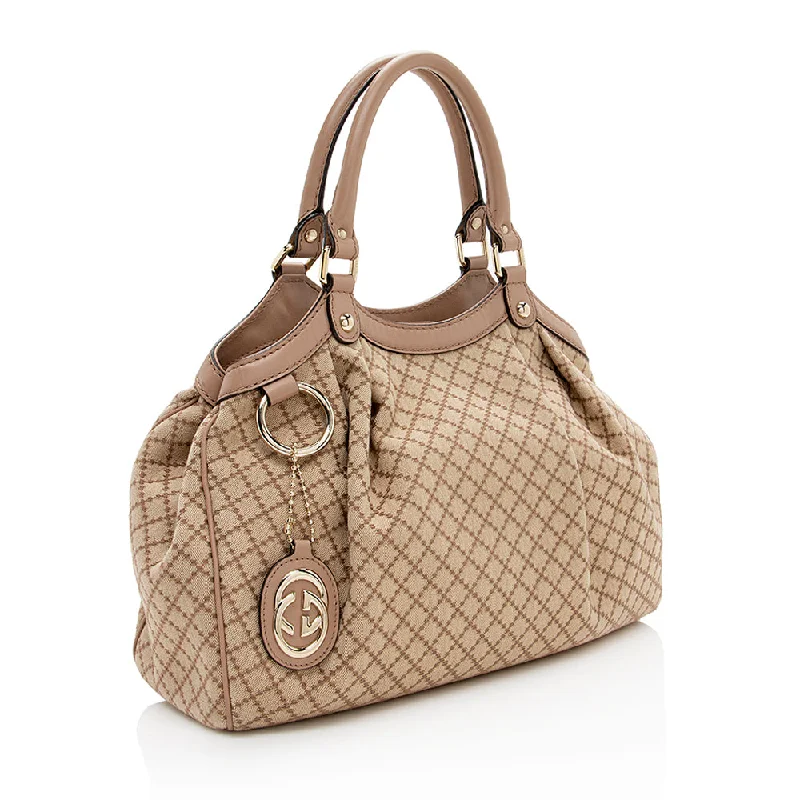 Women Gucci bags with interlocking G hardware for a classic lookGucci Diamante Canvas Sukey Medium Tote (16354)